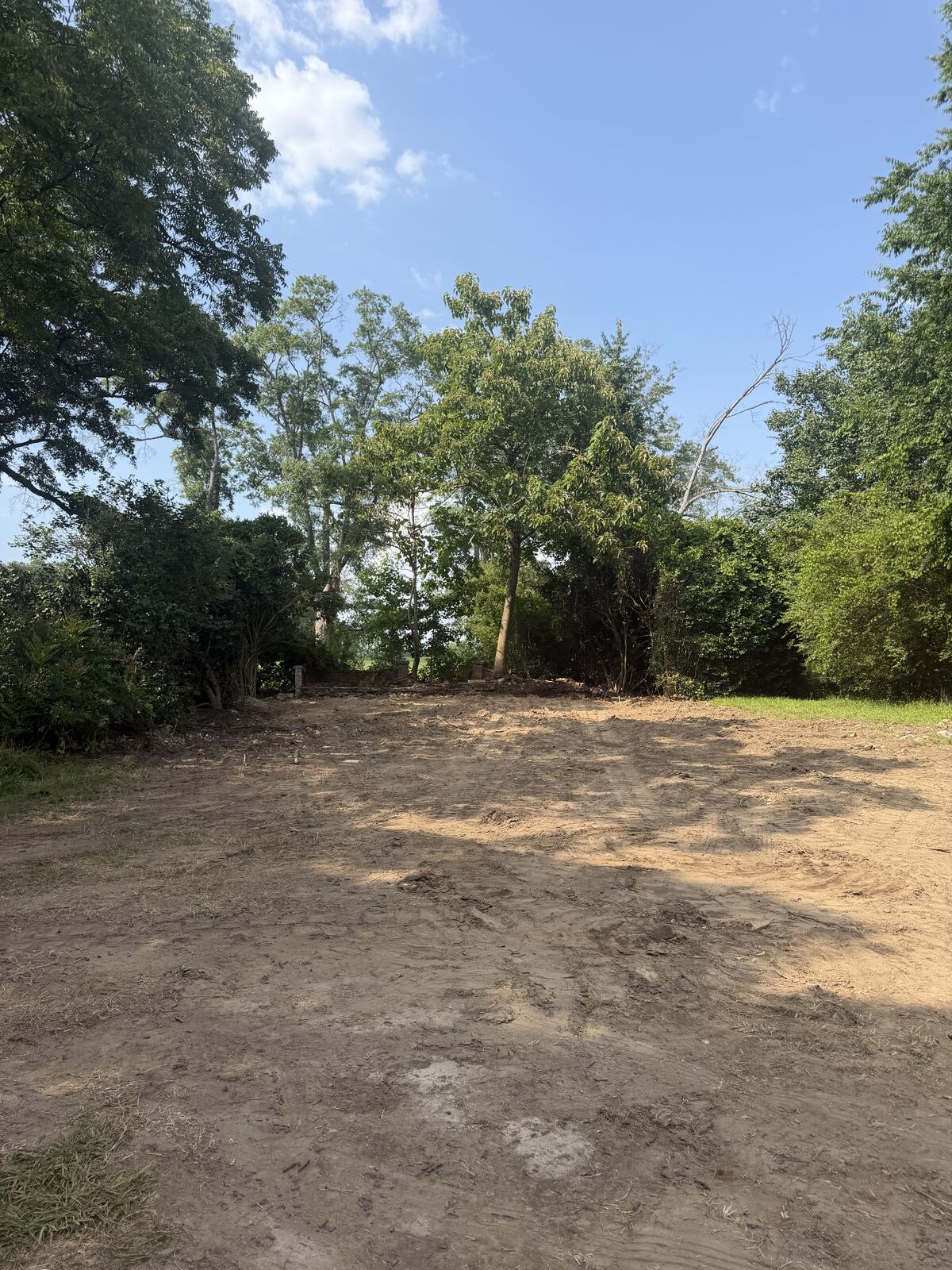 Cleared and graded lot after demolition debris was hauled off